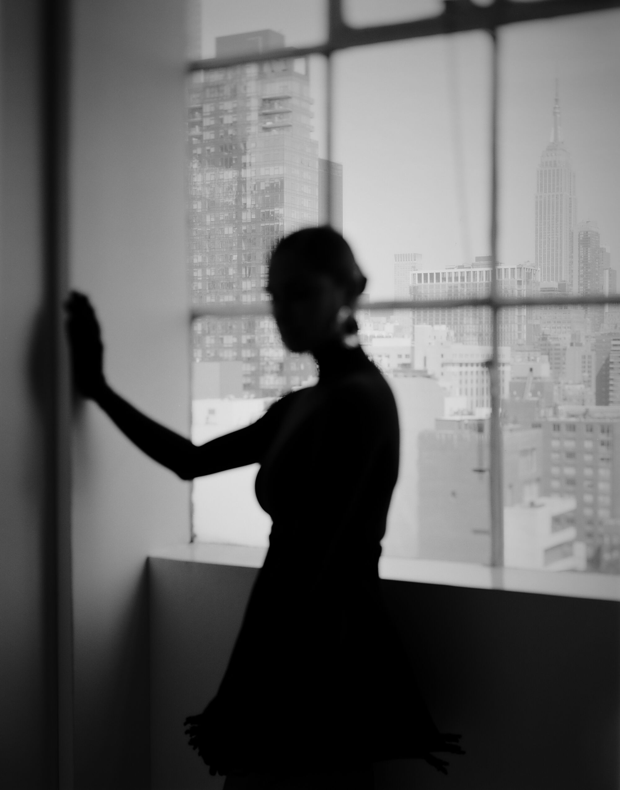 Misty Copeland is silhouetted against a window.