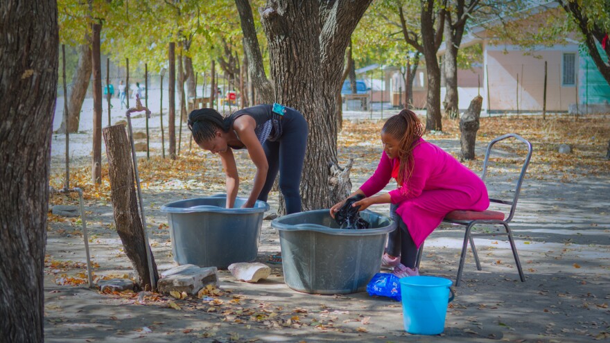 In Botswana, people gather in the shade of a tree to do laundry, to socialize and to celebrate.