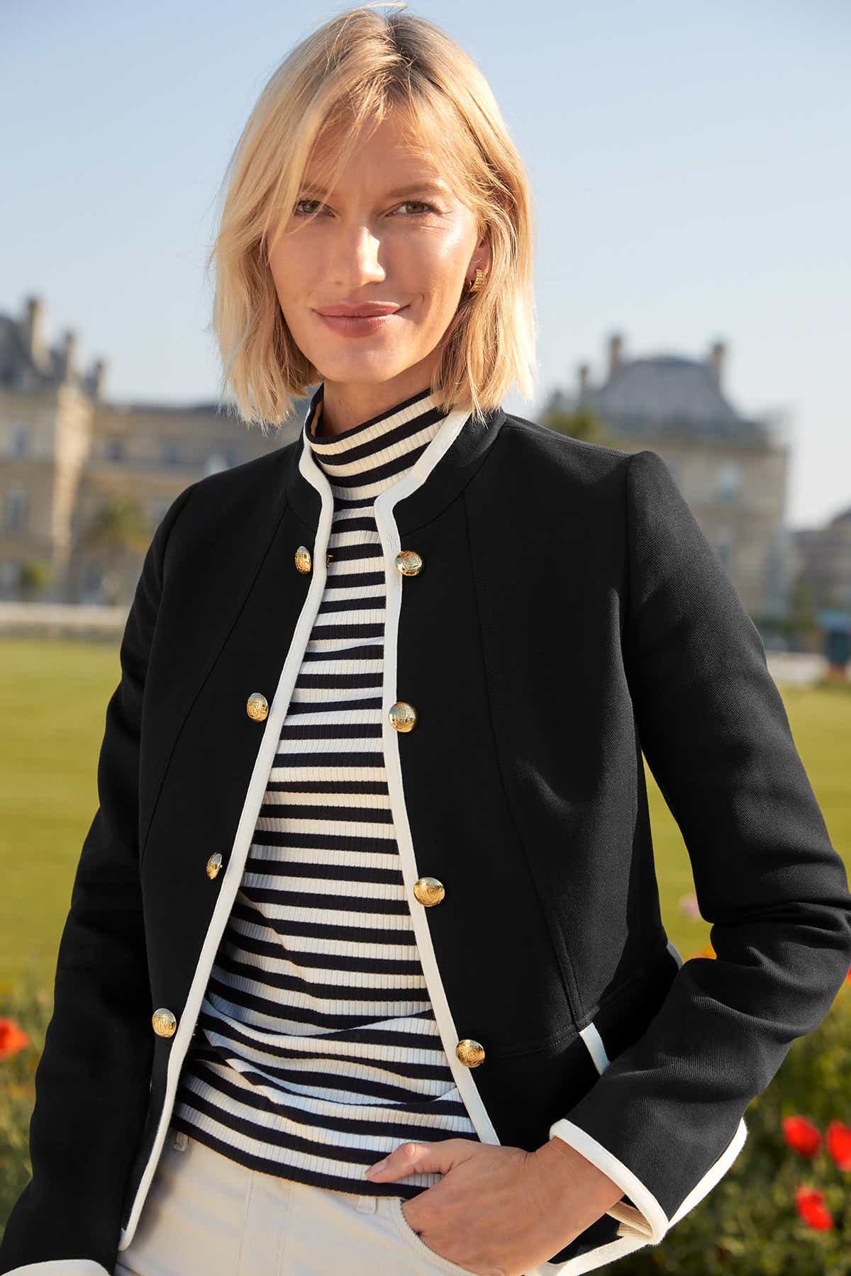 Woman in mock beck sweater and blue blazer