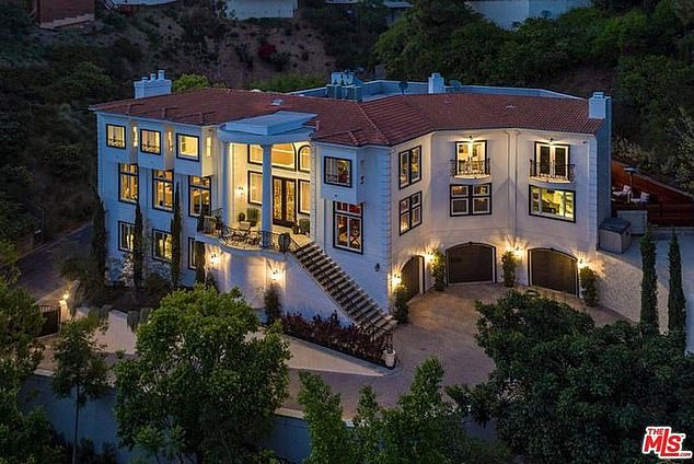 Real Housewives of Beverly Hills stars Dorit and Paul Kemsley were robbed while they were away from the $12.75million mansion, pictured. The couple realized that several high-ticket items had been taken, with cops estimating around $2.5million worth of valuables was stolen