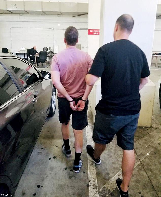 Jason Emil Yaselli, pictured here being arrested by cops, claims that he had nothing to do with the thefts. But authorities say that he is just as 'morally responsible' for the crimes as Ackerman who broke into the homes
