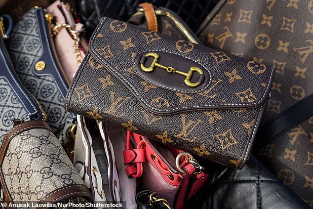 Fake luxury handbags are prepared to be destroyed during a destruction ceremony of intellectual property rights infringing goods in Bangkok, Thailand, 31 August 2023