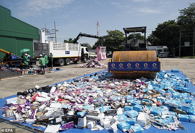 A steamroller crushes counterfeit and license violating goods during a destruction ceremony of intellectual property rights infringing goods in Bangkok, Thailand, 31 August 2023