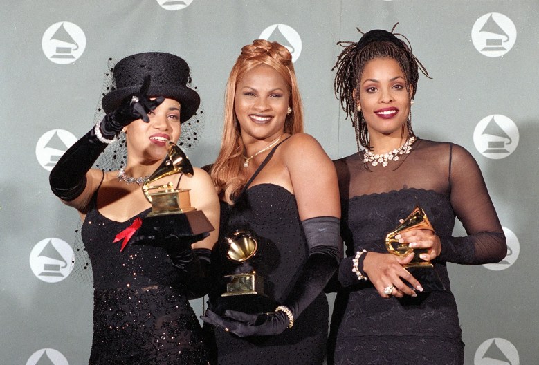 Salt N' Pepa holding their Grammy Awards