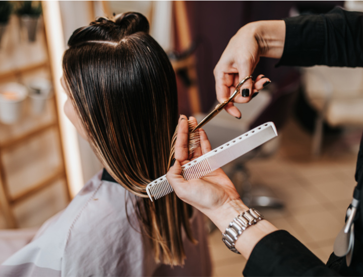 Woman trimming hair