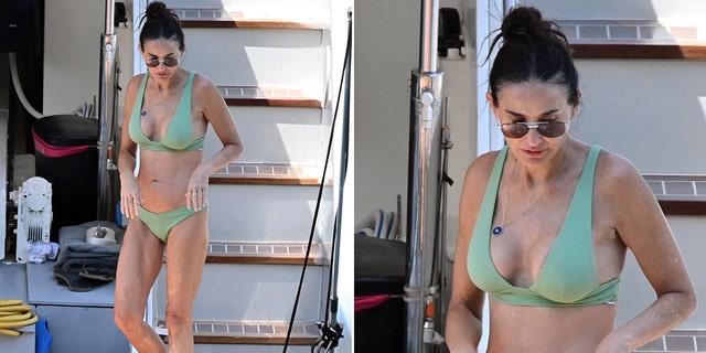 Demi Moore in a green bikini on a yacht