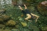 A cyclist cools off in the Pance River after a two and a half hour bike ride. In this hot summer, it's often hard to find a quiet spot in the river to cool down after a ride.