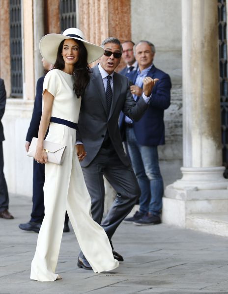 Clooney wearing a white pantsuit