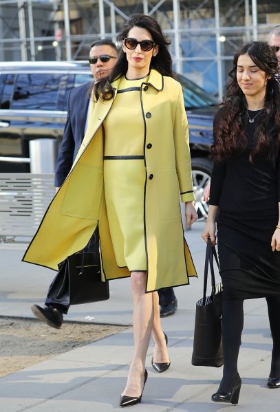 Clooney wearing a matching yellow dress and jacket