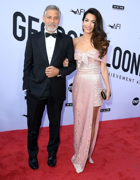 clooney wearing a pale pink metallic dress