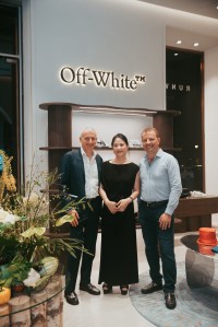 Anh Tran, founder of Runway Vietnam, middle, with guests at the opening of the Runway Vietnam store at Diamond Plaza.