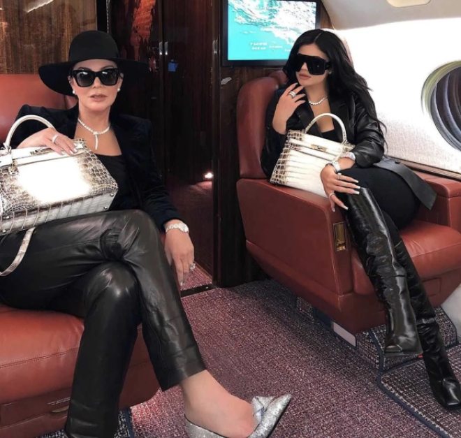 Kris and Kylie Jenner on a flight with their Hermès Niloticus Crocodile Himalaya Birkins