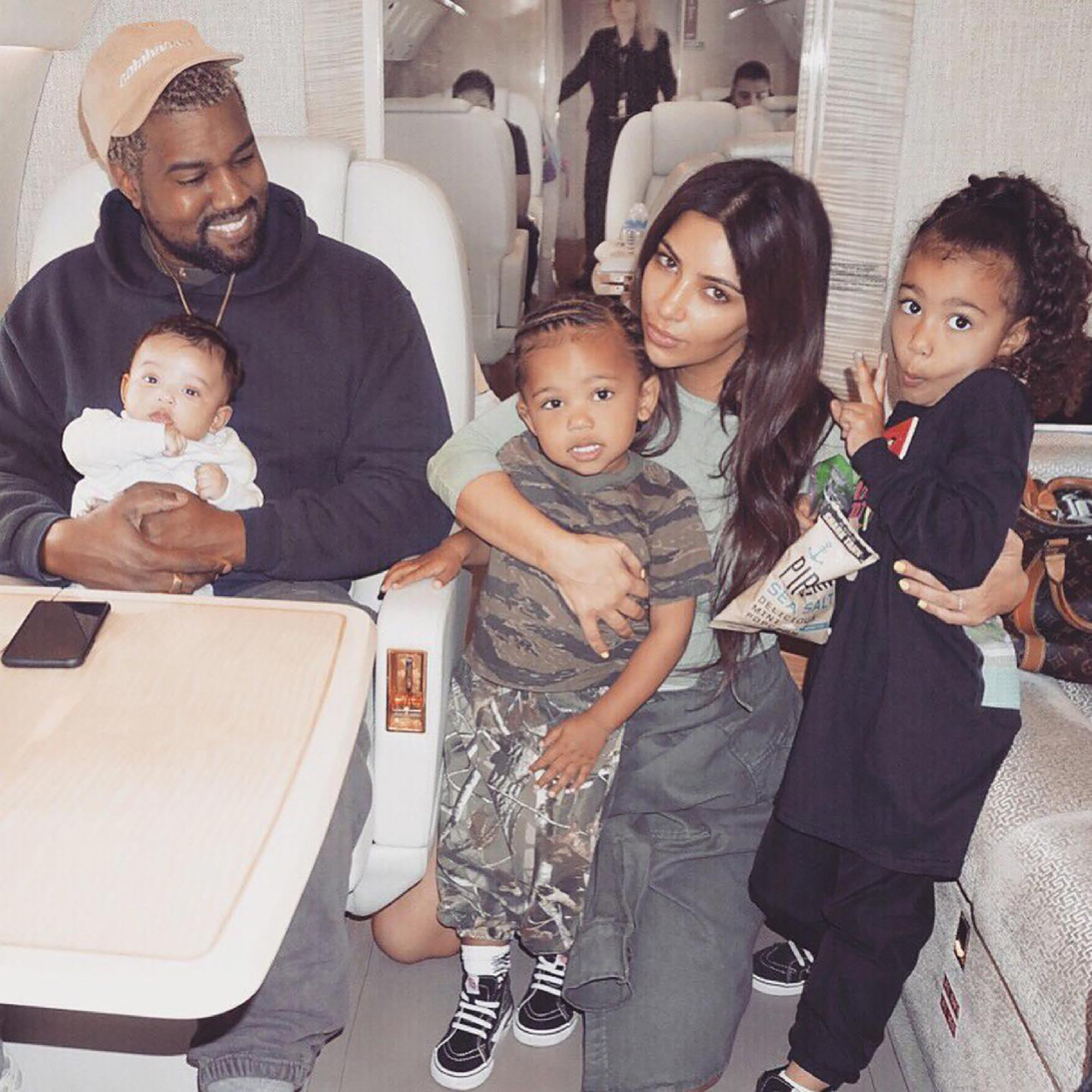 Kim Kardashian and Kanye West with their kids