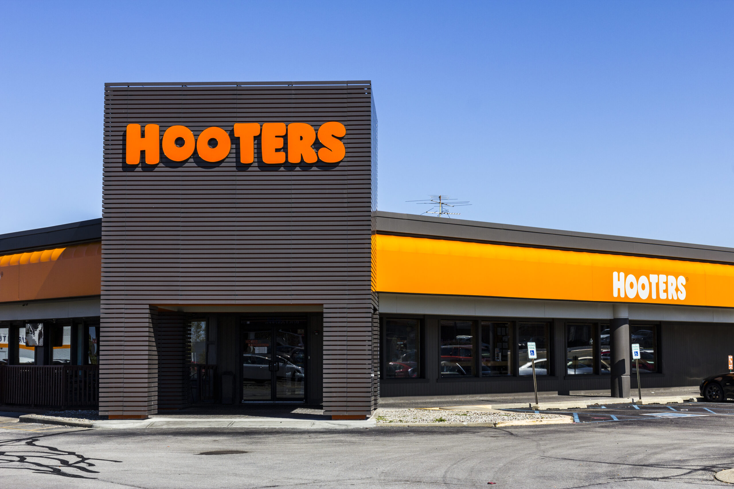 The suit alleges that the Hooters racially discriminated against Black and dark-skinned employees