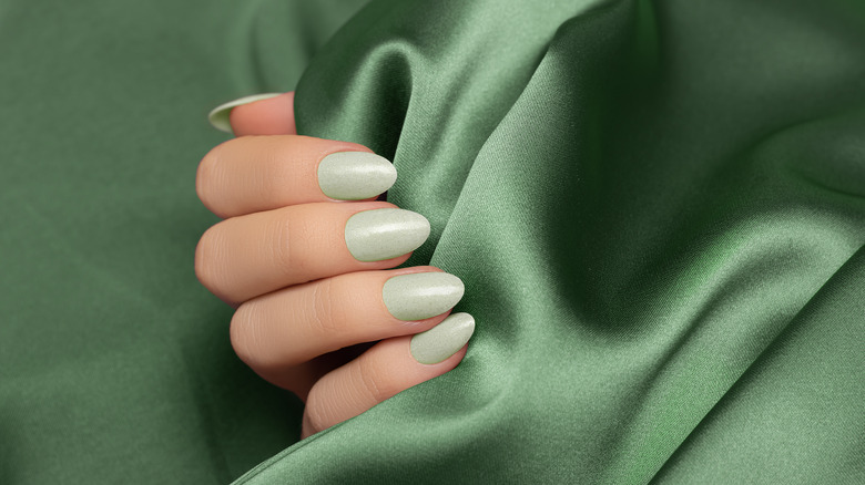 Woman with green nails