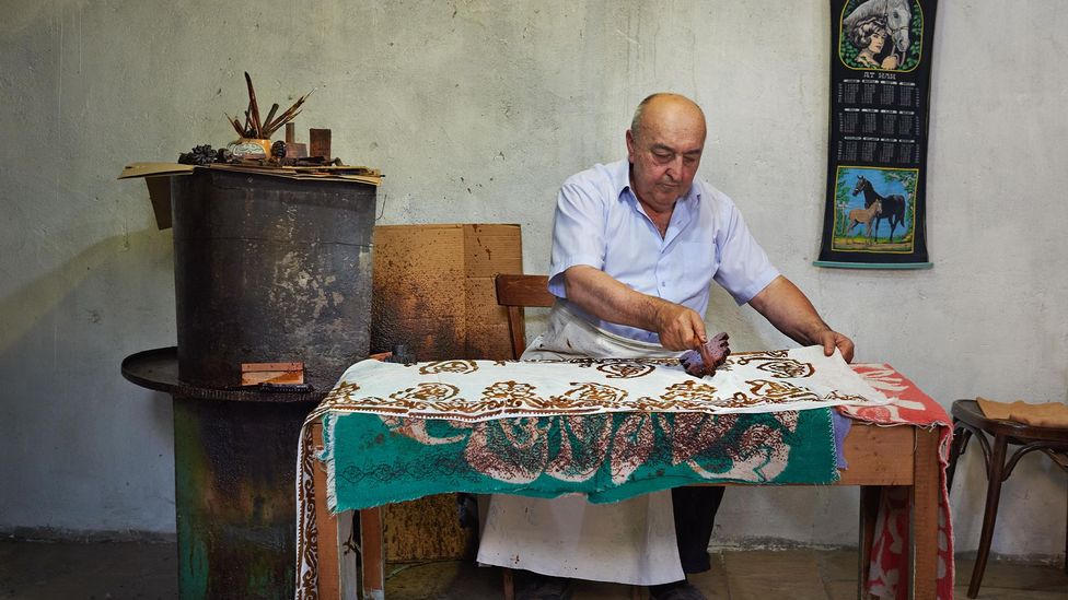 Today, Shamilov runs the last remaining independent kelaghayi shop in Sheki (Credit: Simon Urwin)