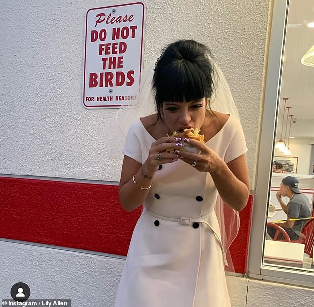 Tucking in: The couple treated themselves to a burger after the ceremony