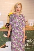 Savannah Miller wearing a floral dress stands in front of a retail counter