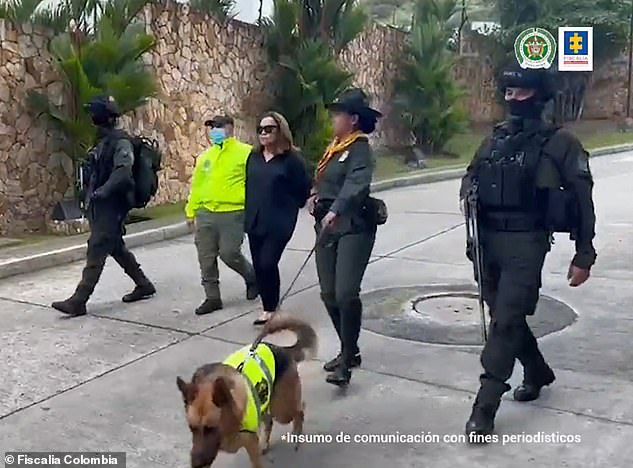 Nancy Gonzalez seen here in handcuffs in July 2022 after being arrested by authorities in Cali, Colombia for smuggling endangered crocodile and snake skin bags into the US