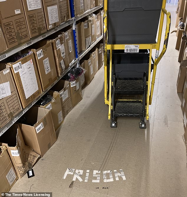Staff have left messages on the floor of the Boohoo warehouse in Burnley, including this one reading 'prison'