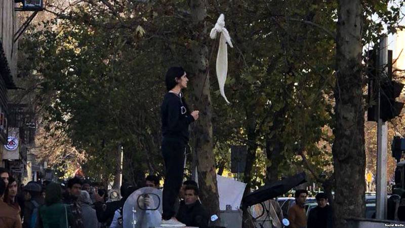 Five years ago, Vida Movahed climbed on to a utility box on Revolution Avenue, Tehran, stuck her white hijab on a wooden stick and waved it in the air. How fateful the act of protest turned out to be. Photo: Ay-Collection / Sipa / Shutterstock