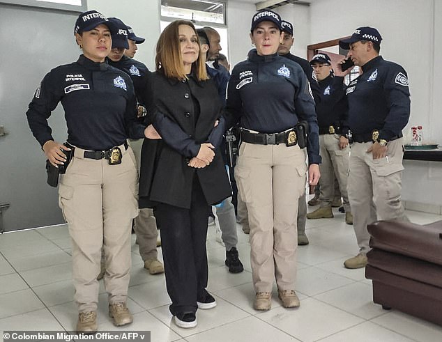 Colombian fashion designer Nancy Gonzalez, 78, is seen smirking at the camera as she is extradited at El Dorado International Airport in Bogota back to the United States