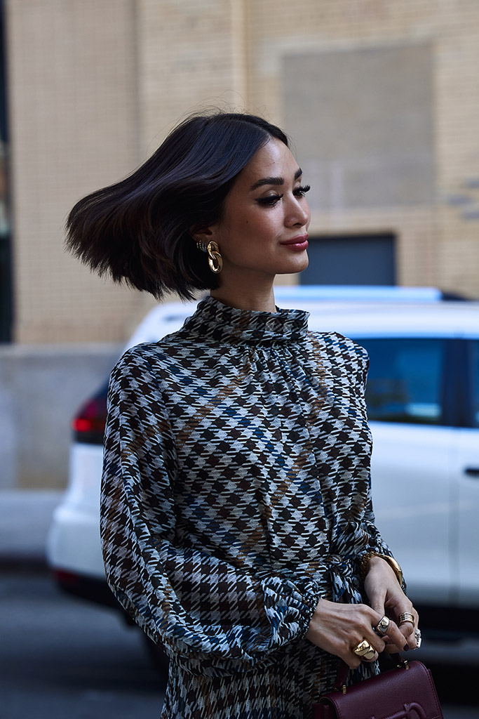 Heart Evangelista at Carolina Herrera. Photo: Tobi Sobowale walking down the road with hair swooshing action captured street style model