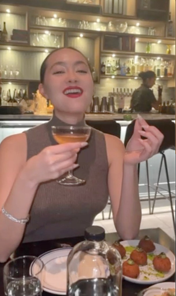 Zoe Kim Kenealy enjoying her martini.