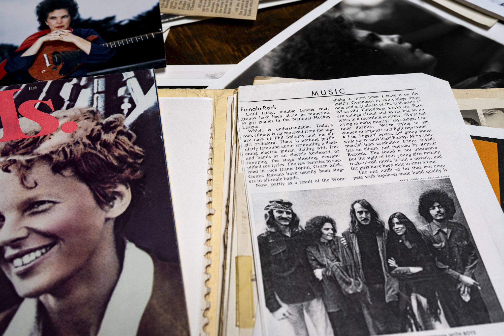 An array of magazine and newspaper clippings spread out across a table top and featuring Terry Garthwaite.