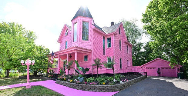 An older home painted pink.