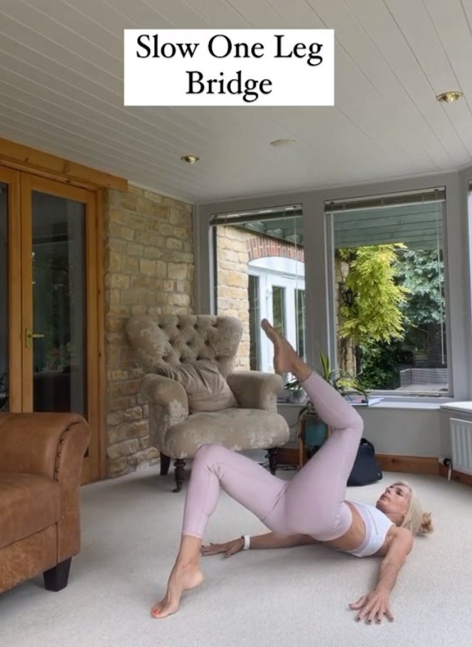 Keeping the small of her back off the ground, she did one-leg bridges to strengthen her glutes