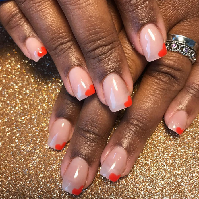 nails with red hearts in corner.