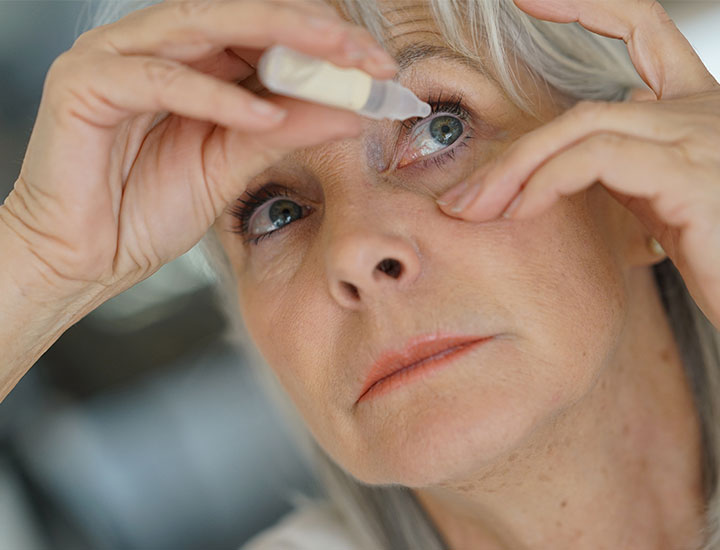 woman-applying-eye-drops