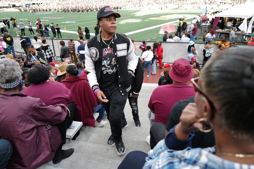 A fan walks up the bleachers inside Legion Field Stadium at the 2022 Magic City Classic in Birmingham, Alabama.