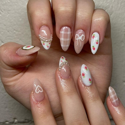 Soft neutral plaid nails with pearls and bow nail art designs.