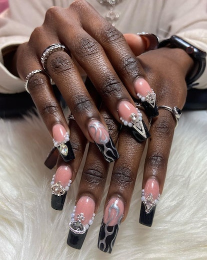 Black French tip nails are a trendy Halloween nail design for 2023.