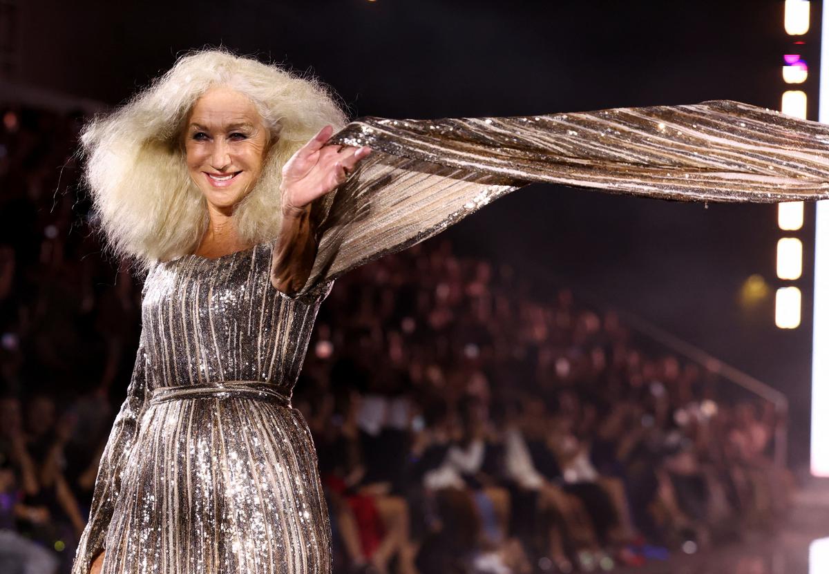 Actor Helen Mirren presents a creation during a public show named ‘Walk Your Worth’ organised L’Oreal near the Eiffel Tower as part of Paris Fashion Week, in Paris, France