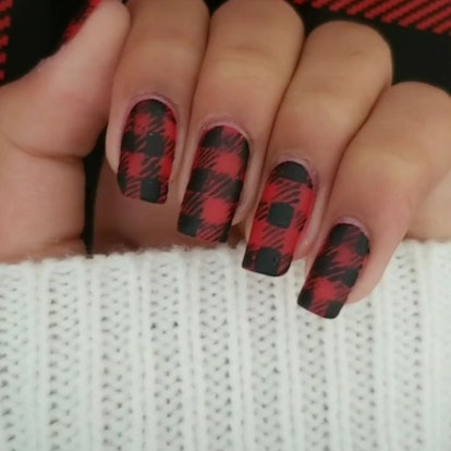 Red and black Buffalo-print plaid nails are a perfect manicure design for fall/winter 2023.