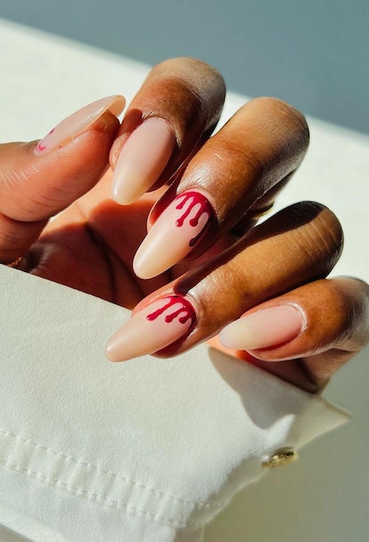 If you need ideas for vampire nails for Halloween 2023, try a simple red blood drop nail design.