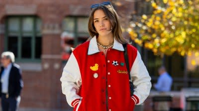 Fashion girl in varsity jacket