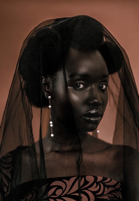 An African woman wearing a black veil, from the series Hair and Melanin, by Margaret Njeri Ngigi. She saysthe series is about the enduring and detrimental impact of colourism on black women, and is ‘an ode to black skin girls put to shame, and [who are] robbed of happiness and joy because of the colour of their skin and the texture of their hair’.