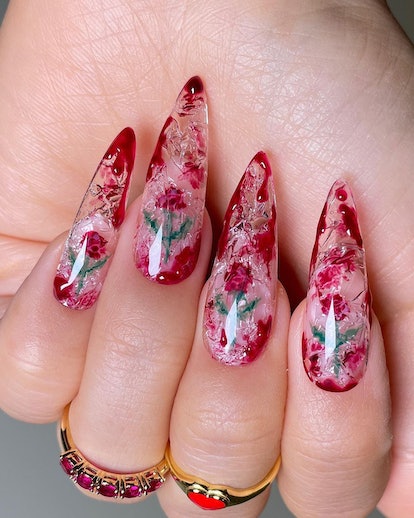 If you need ideas for vampire nails for Halloween 2023, try a trendy clear & red rose blood splatter...