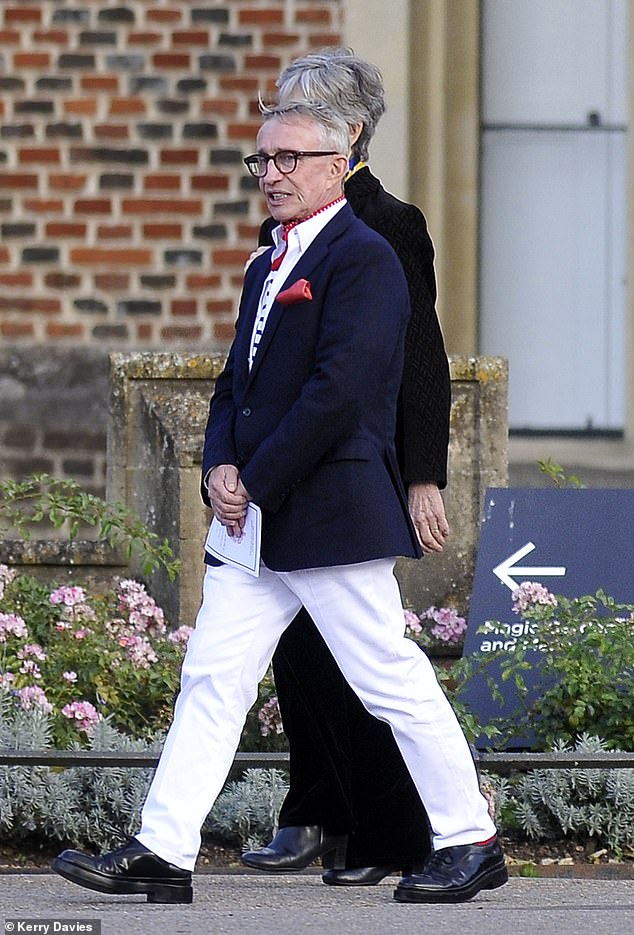 Mr Conran looked stylish as he attended the memorial in white trousers, a dark suit jacket, a stripy top and red neckerchief