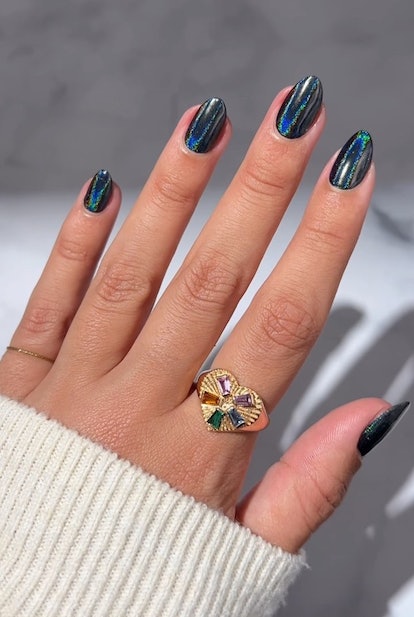 Black holographic chrome nails for scorpio season 2023 manicure ideas.