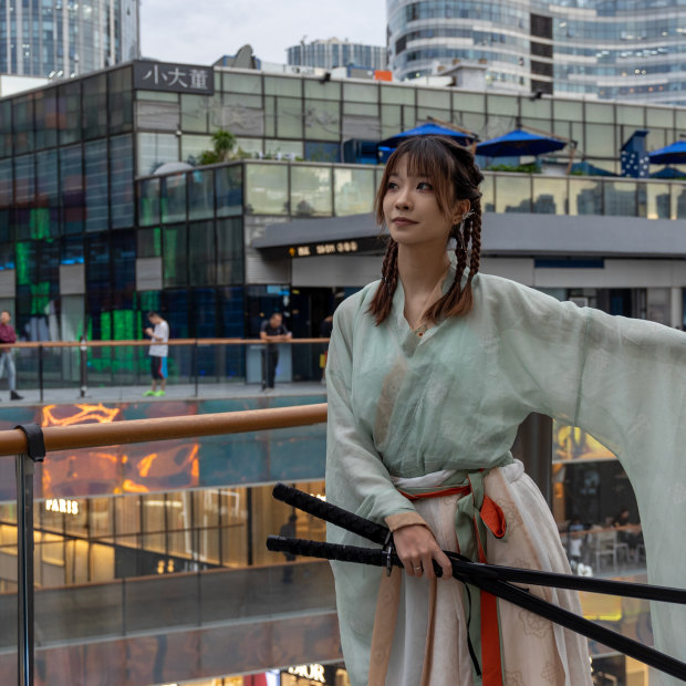 Shen Guohua in a traditional Chinese costume in Beijing’s Sanlitun district. 