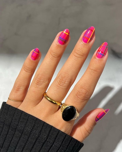 Short hot pink plaid nails.