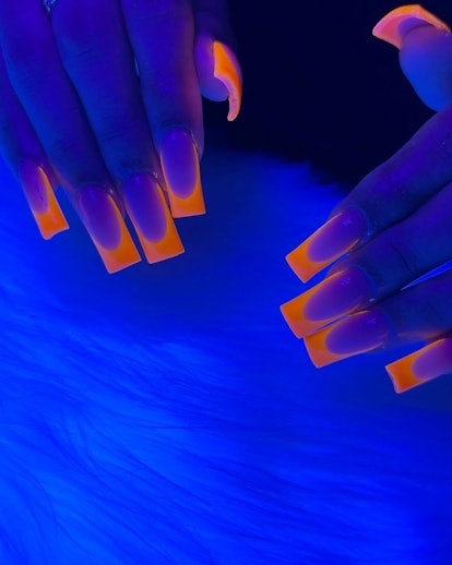 Neon orange French tips.