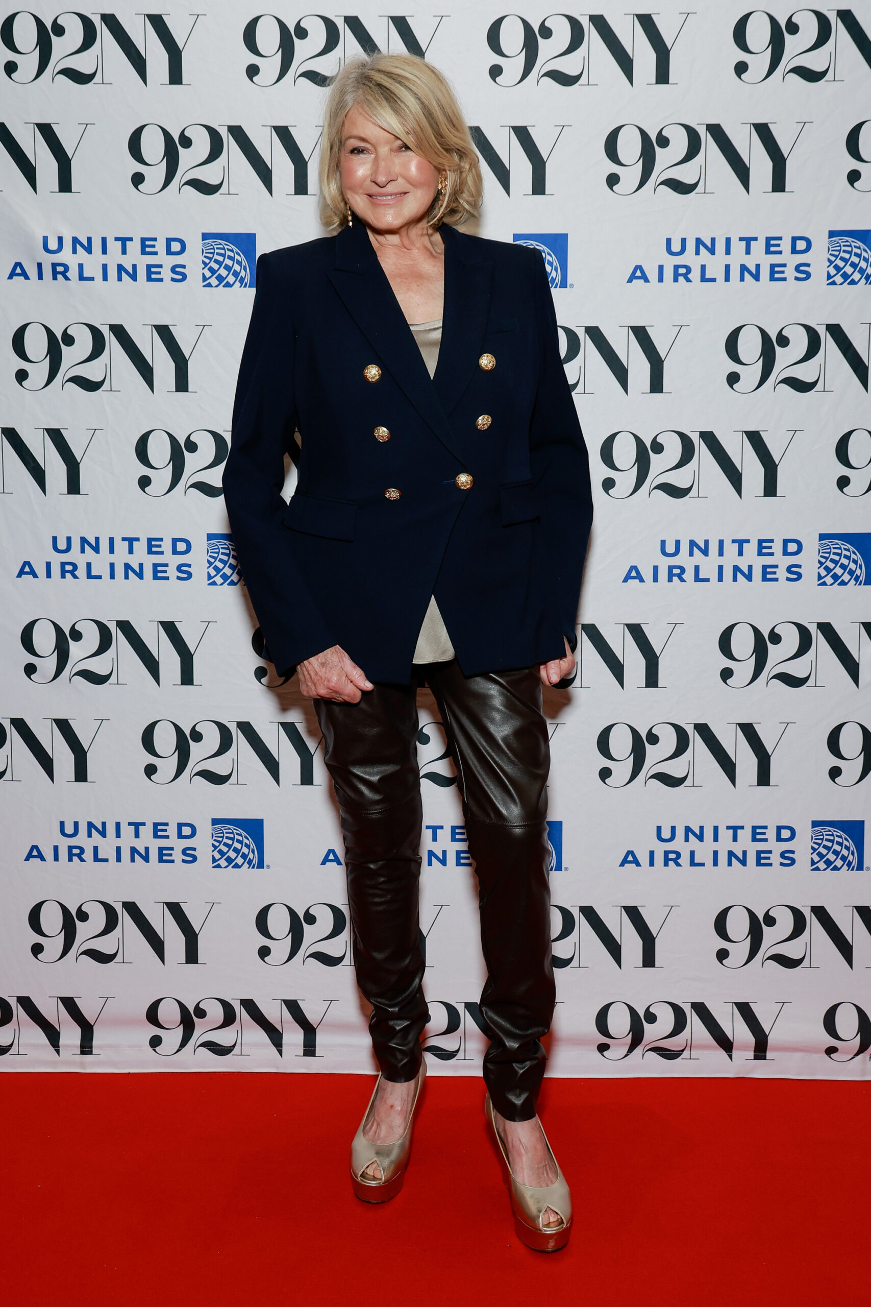 Martha wore skintight leather pants with beige sandals