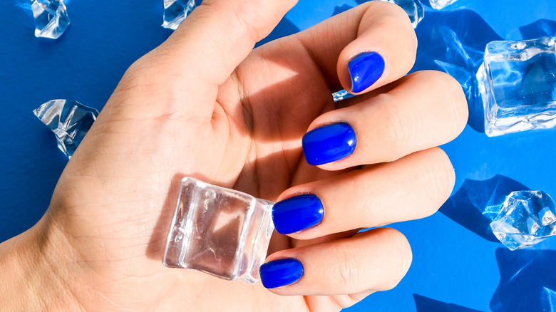 Hand with cobalt blue nails