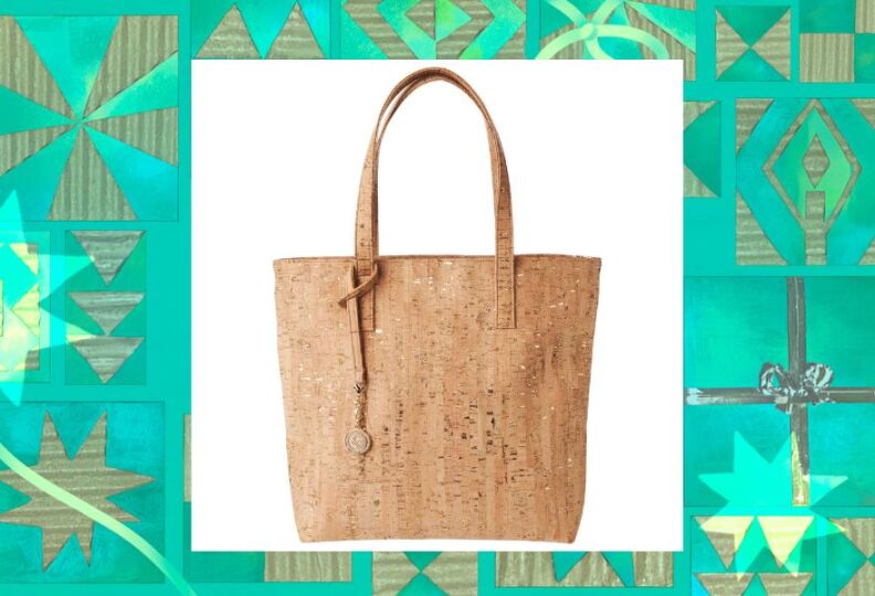 A photograph of a stylish tote bag with lots of textures — because it hand-crafted from cork, and is vegan and sustainable and made in L.A. The image is set against a decorative green background accented with stars, gift boxes and strands of ribbon.